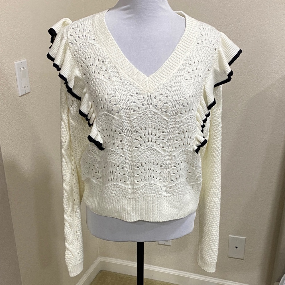 Elegant Cream V-Neck Sweater with Black Ruffle Trim